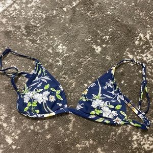 Very cute swim suit top it’s like a navy blue with a floral design on it